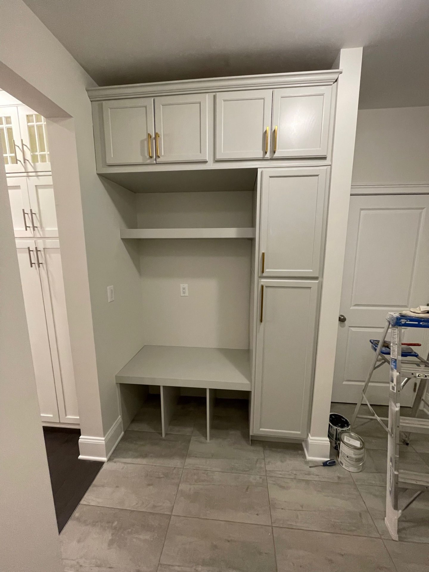 Mudroom bench and cabinetry finished in a soft warm gray